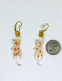 White Playful Cat Dangles